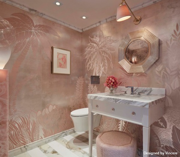 elegent salmon colored washroom with a vanity mirror